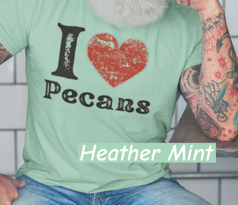 Lifestyle mockup of a Bella+Canvas 3001 unisex t-shirt featuring a distressed vintage I ❤ Pecans graphic, Southern Americana style, perfect for pecan lovers and nostalgic foodies.