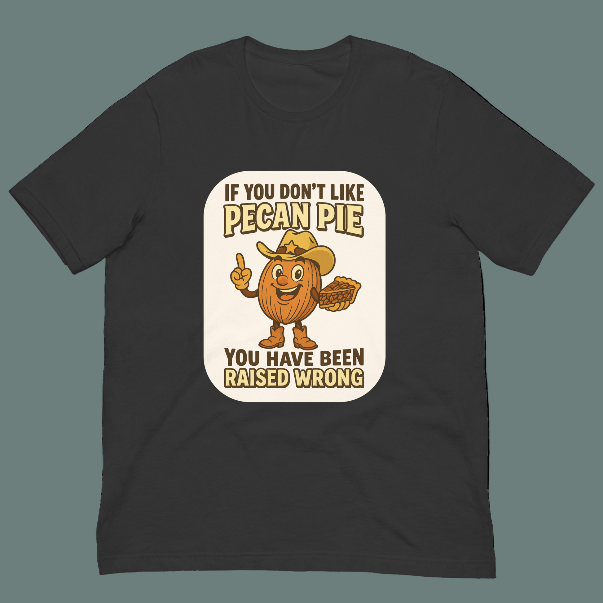 Bella+Canvas 3001U t-shirt made in USA featuring cartoon pecan cowboy holding pie with text ‘If you don’t like pecan pie, you have been raised wrong.’