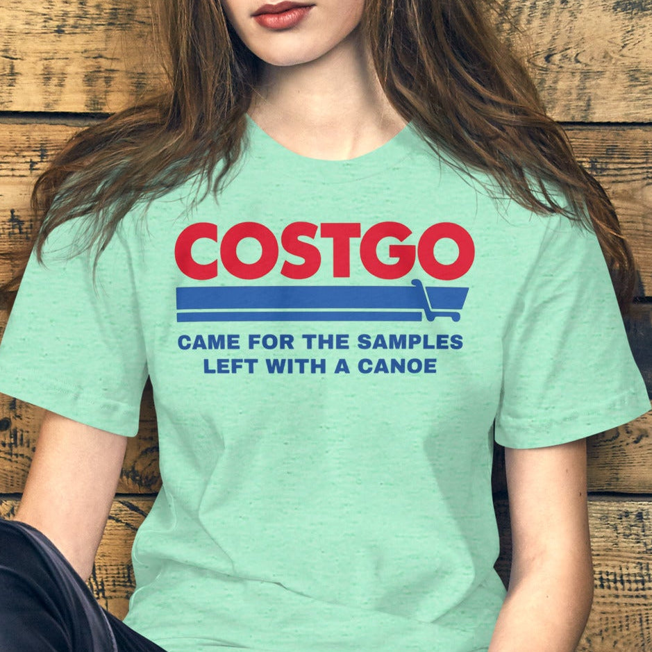 Costgo Samples Funny T-Shirt parodying Costco, printed on a soft unisex Bella + Canvas 3001 tee by NuttyMerch, featuring the phrase “Came for the Samples, Left with a Canoe.” Premium cotton blend, casual fit, and available in assorted colors.