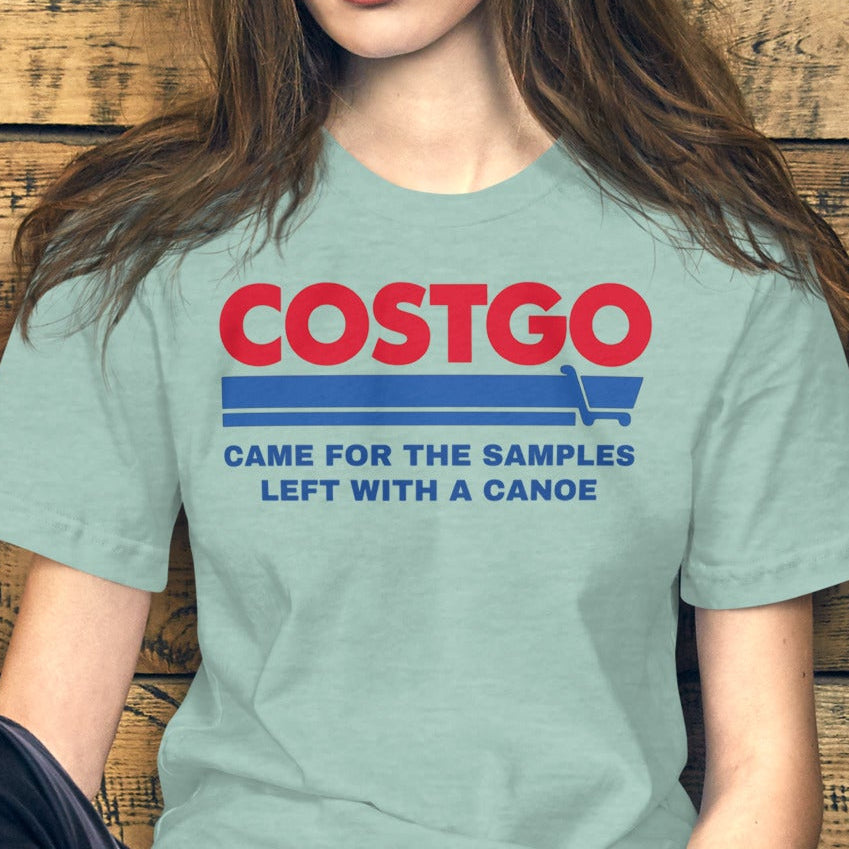 Costgo Samples Funny T-Shirt parodying Costco, printed on a soft unisex Bella + Canvas 3001 tee by NuttyMerch, featuring the phrase “Came for the Samples, Left with a Canoe.” Premium cotton blend, casual fit, and available in assorted colors.