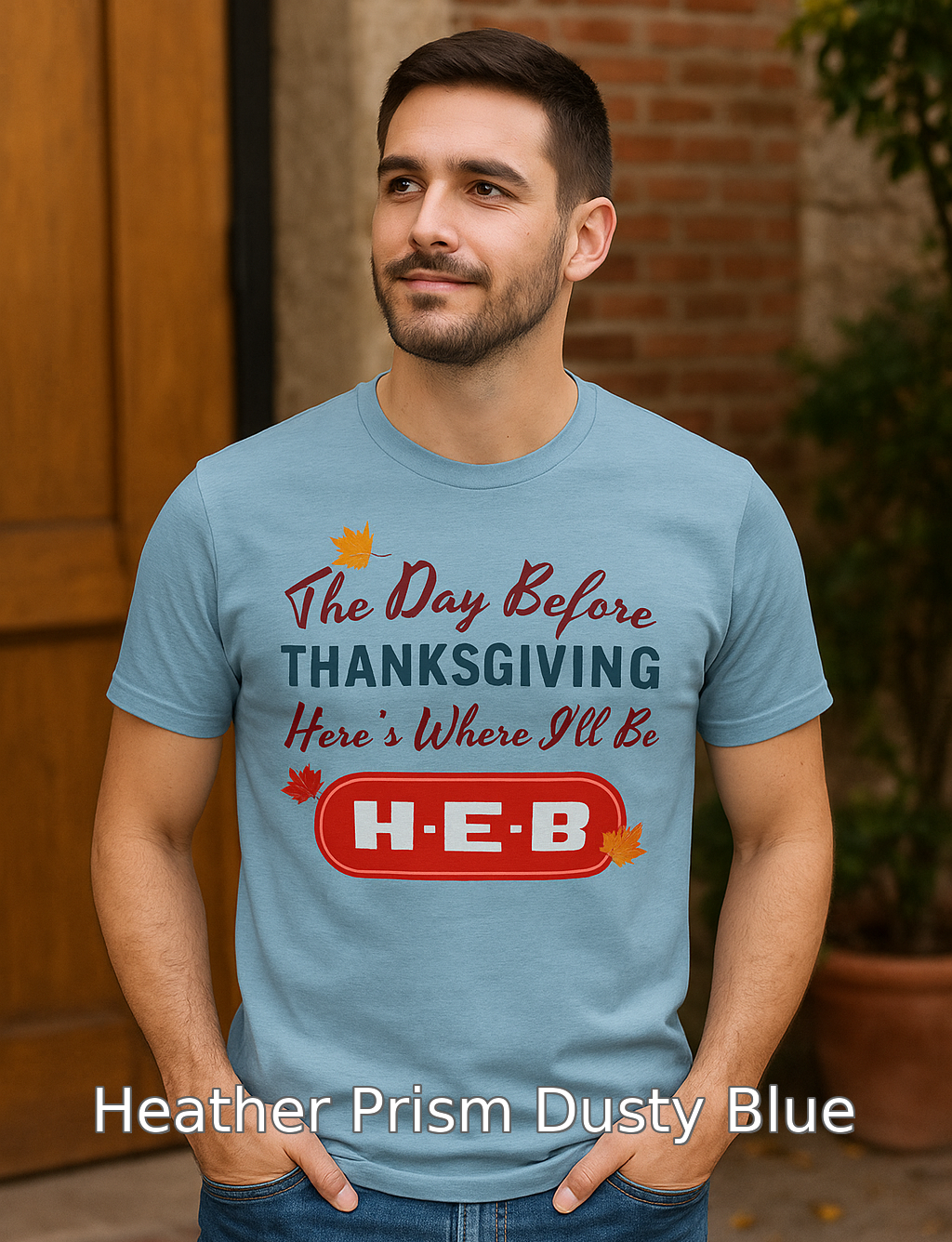 Man wearing a Heather Prism Dusty Blue t-shirt with Thanksgiving text and H-E-B logo.