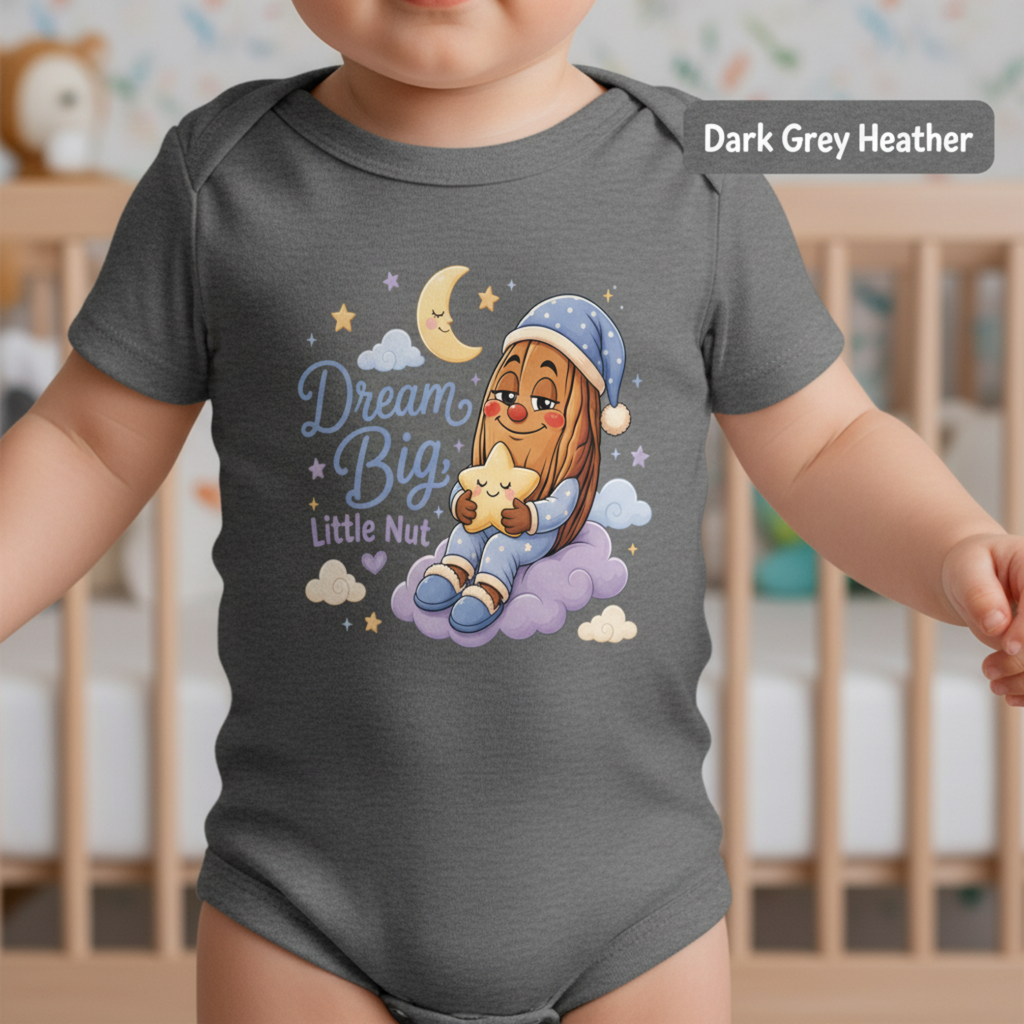 A baby wearing a dark grey heather short-sleeve bodysuit with a colorful cartoon graphic of a bearded nut holding a star under a crescent moon and the words 'Dream Big Little Nut'.