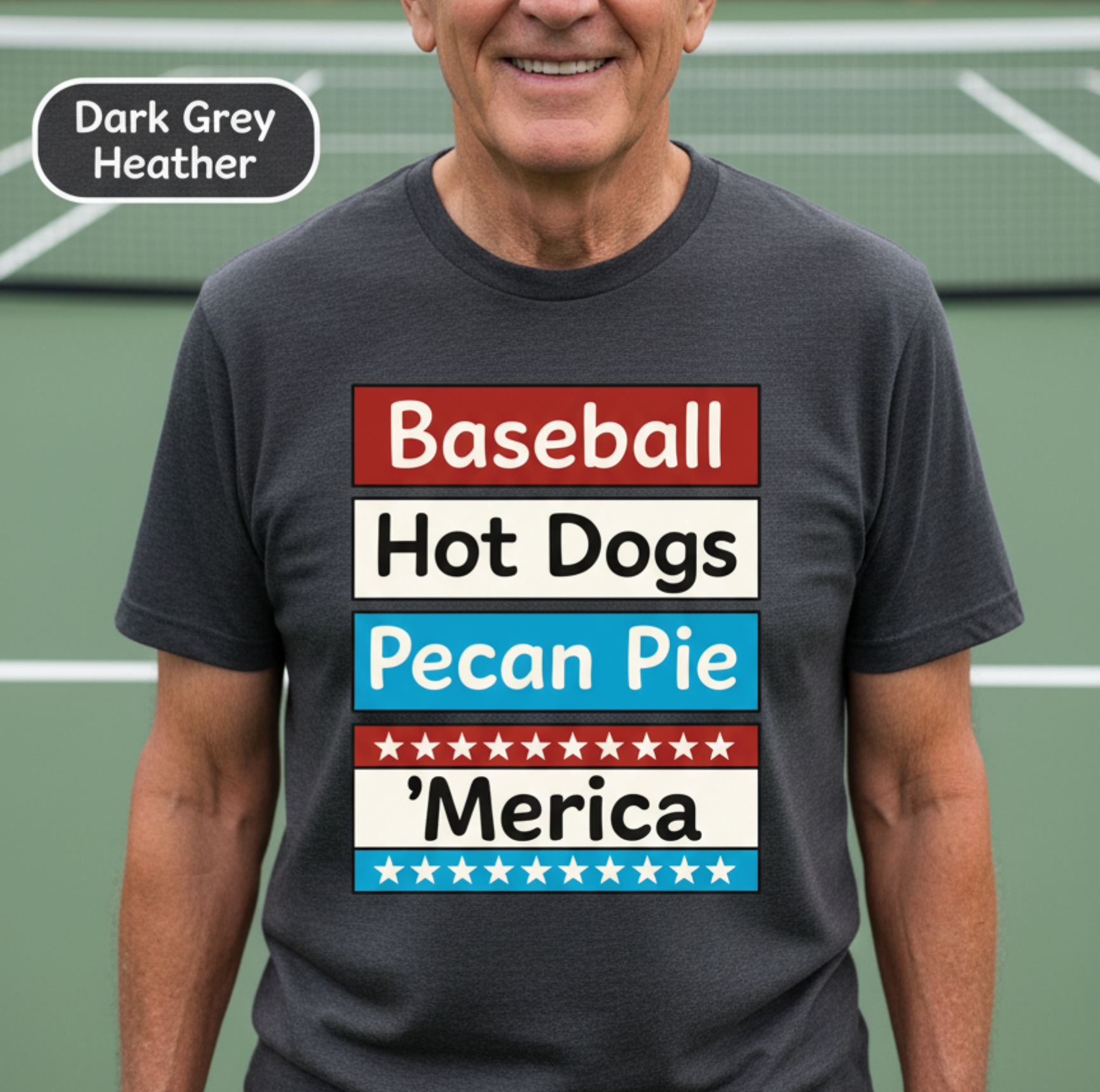 Man wearing a t-shirt with 'Baseball, Hot Dogs, Pecan Pie, §merica' text on a tennis court.
