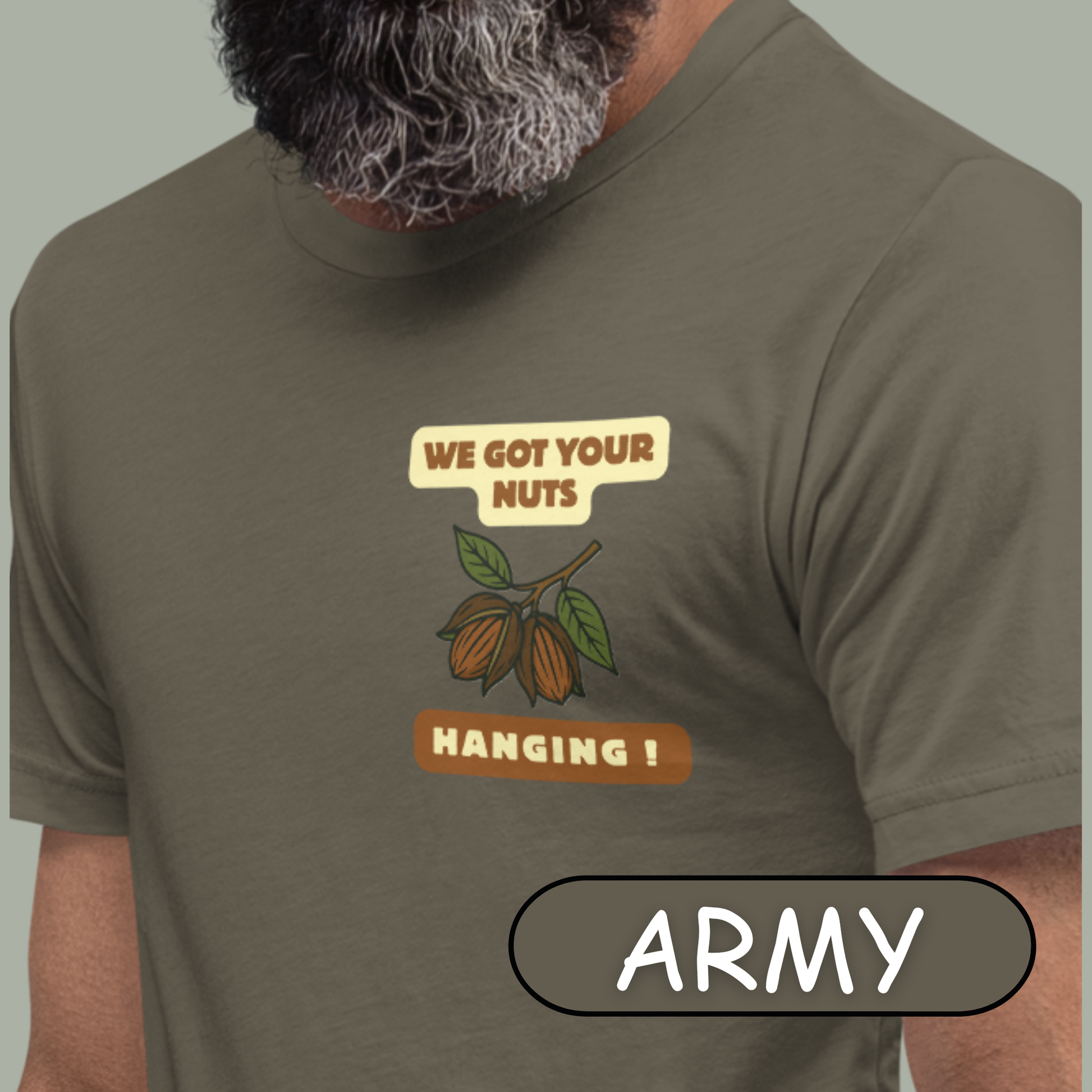 “NuttyMerch We Got Your Nuts Hanging parody graphic with pecans in husks and leaves printed on the upper left chest of a Bella + Canvas 3001 t-shirt”