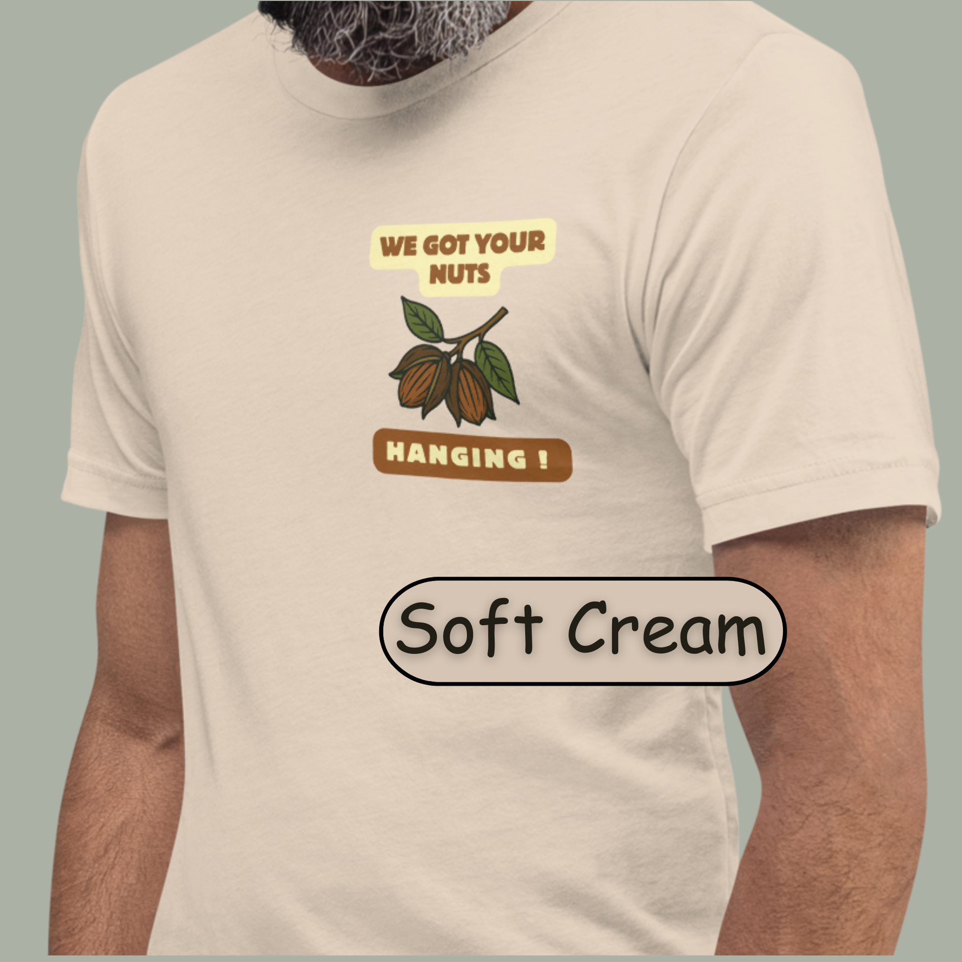 “NuttyMerch We Got Your Nuts Hanging parody graphic with pecans in husks and leaves printed on the upper left chest of a Bella + Canvas 3001 t-shirt”