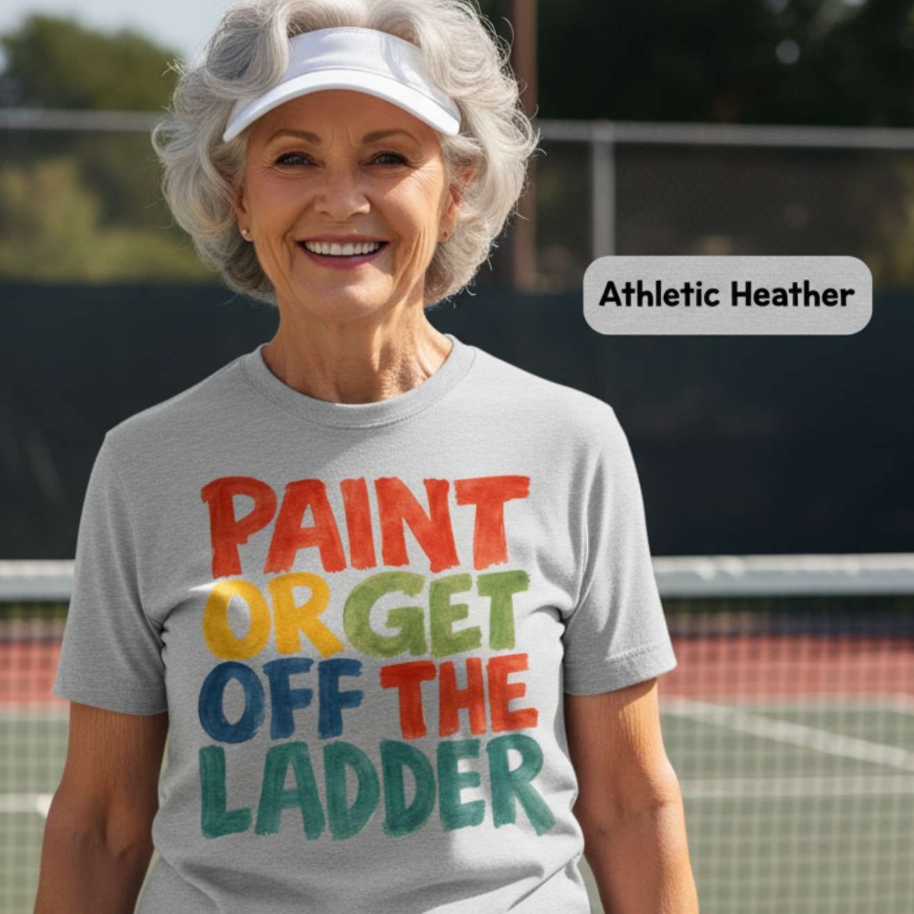 Woman wearing a t-shirt with colorful text on a tennis court