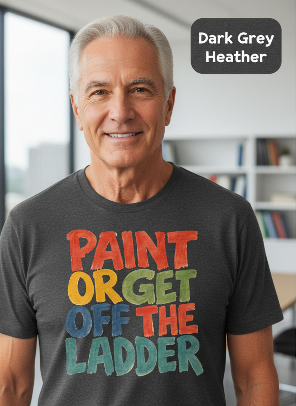 Executive dad wearing a dark gray t-shirt with colorful text in an office setting