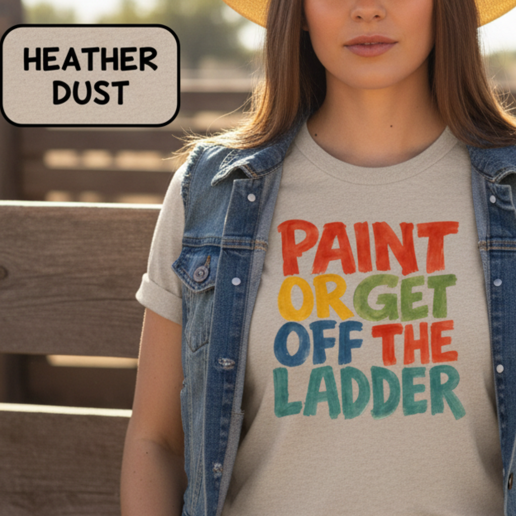 Cowgirl wearing a t-shirt with colorful text and a cowboy hat in a rustic setting