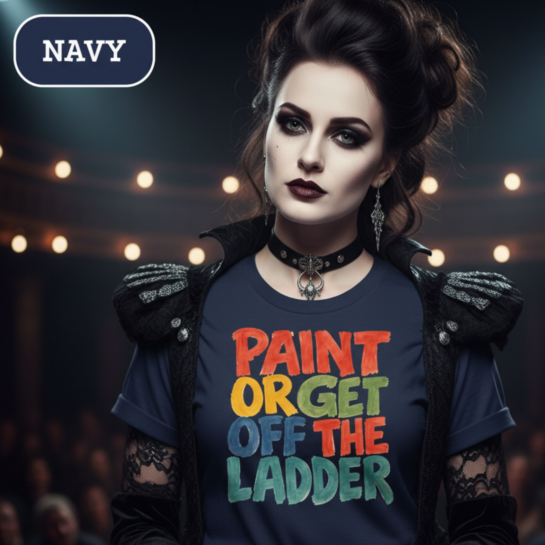 Goth girl wearing a navy t-shirt with colorful text in a theater setting