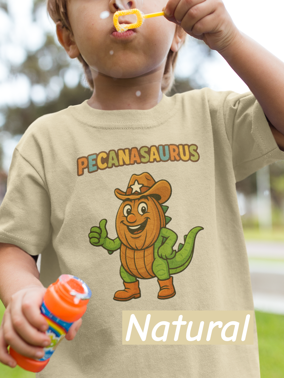 “Natural curved ‘Pecanasaurus’ text in playful multicolor letters designed for a kids dinosaur-themed t-shirt.”
