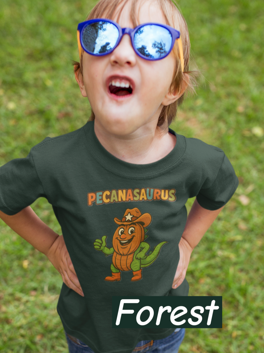 “Forest curved ‘Pecanasaurus’ text in playful multicolor letters designed for a kids dinosaur-themed t-shirt.”