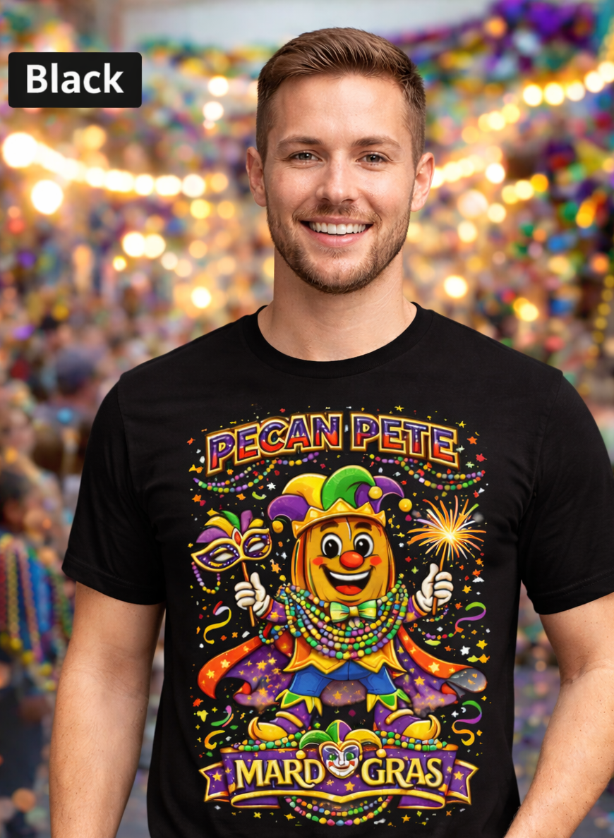 Smiling model wearing a colorful Mardi Gras Pecan Pete graphic T-shirt, featuring a festive jester pecan character with beads, mask, sparkler, and parade confetti, photographed against a lively Mardi Gras celebration background.