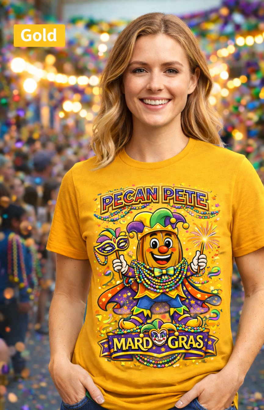Smiling model wearing a colorful Mardi Gras Pecan Pete graphic T-shirt, featuring a festive jester pecan character with beads, mask, sparkler, and parade confetti, photographed against a lively Mardi Gras celebration background.