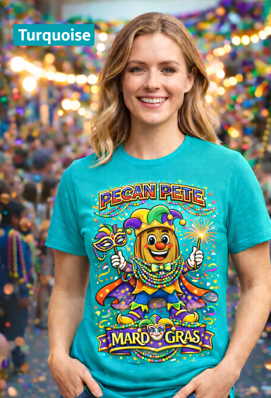 Smiling model wearing a colorful Mardi Gras Pecan Pete graphic T-shirt, featuring a festive jester pecan character with beads, mask, sparkler, and parade confetti, photographed against a lively Mardi Gras celebration background.
