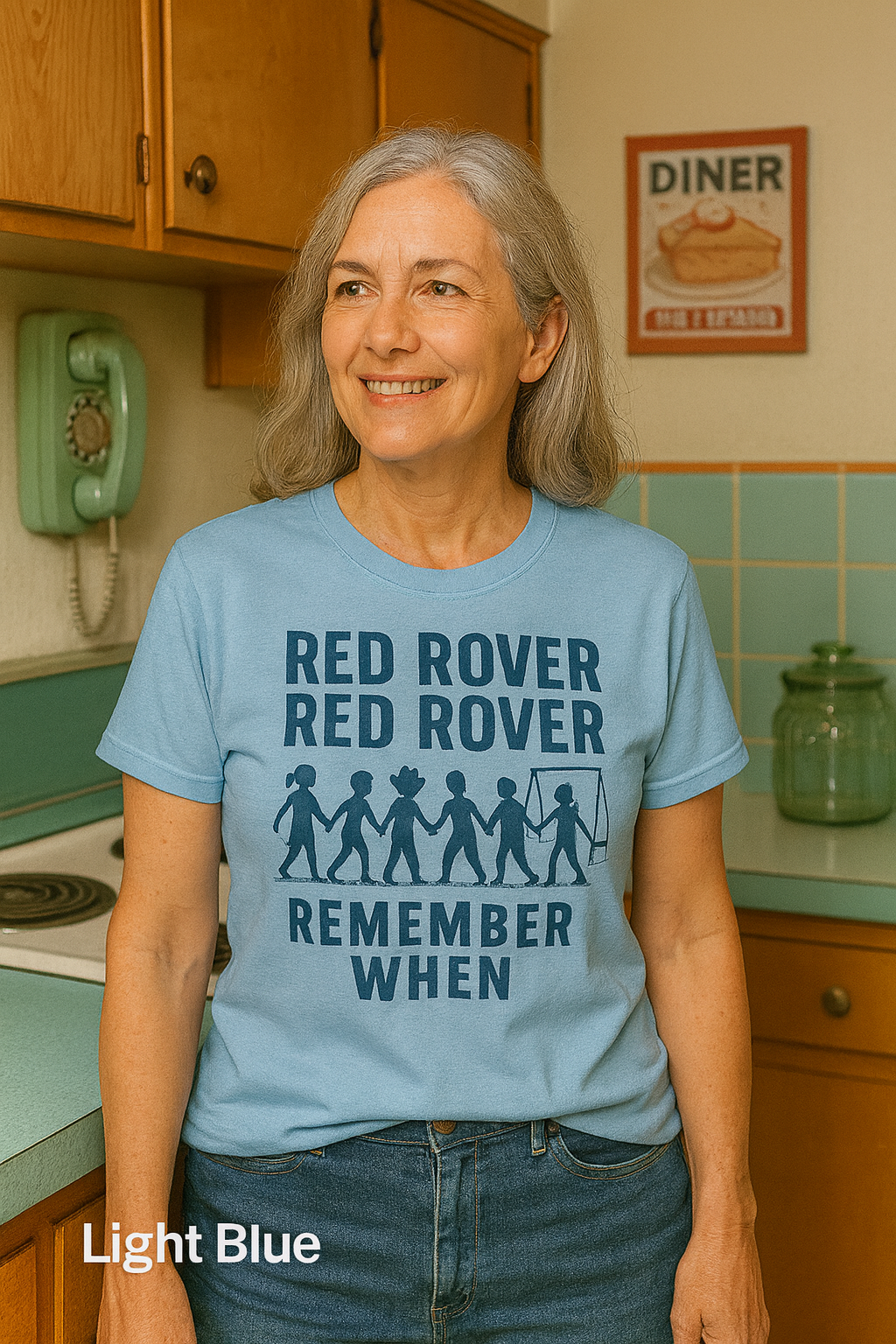 Woman wearing a Bella+Canvas 3001 Athletic LIght Blue t-shirt with vintage Red Rover playground design, NuttyMerch nostalgia collection.”