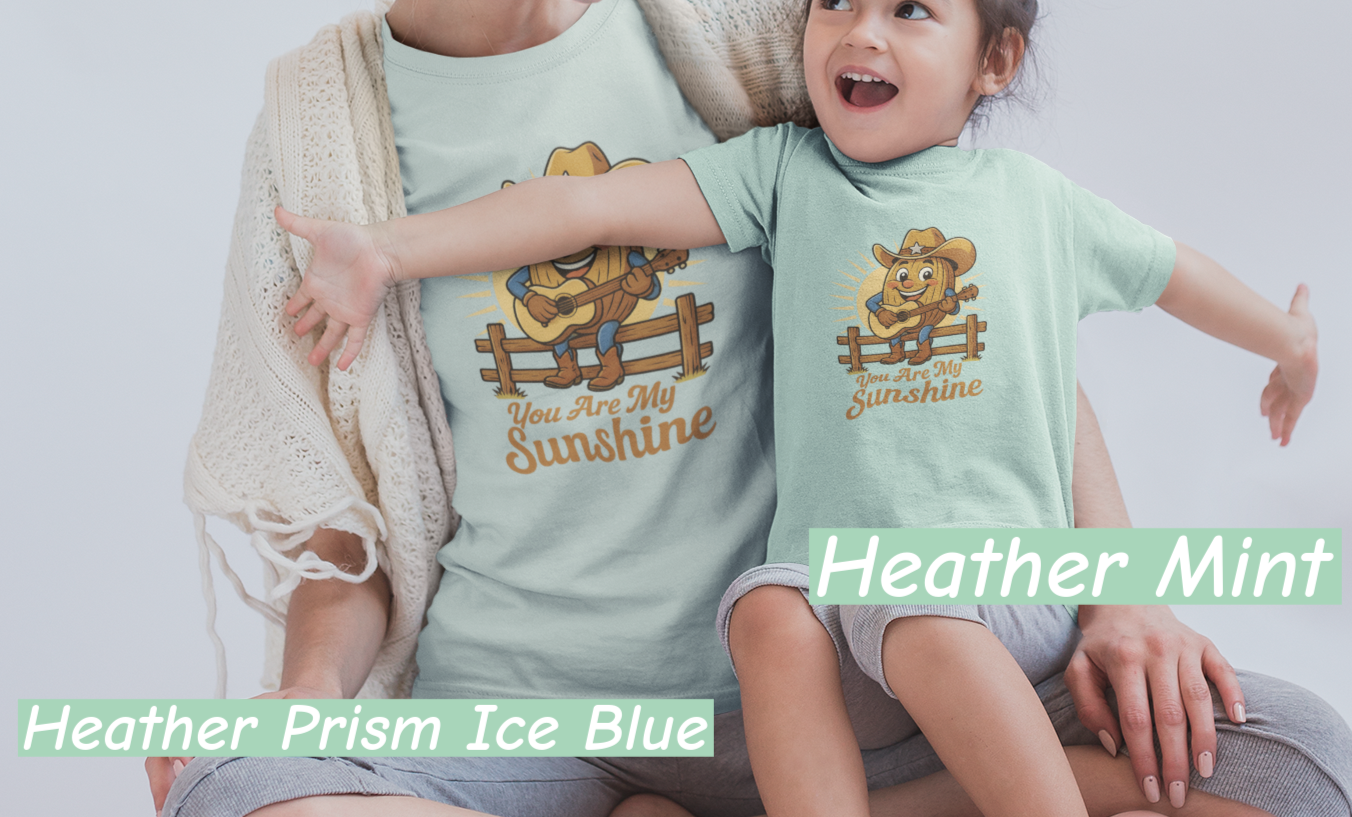 Mother and daughter wearing Bella+Canvas 3001 t-shirt with Pecan Pete singing cowboy design and the phrase You Are My Sunshine, vintage western style graphic tee