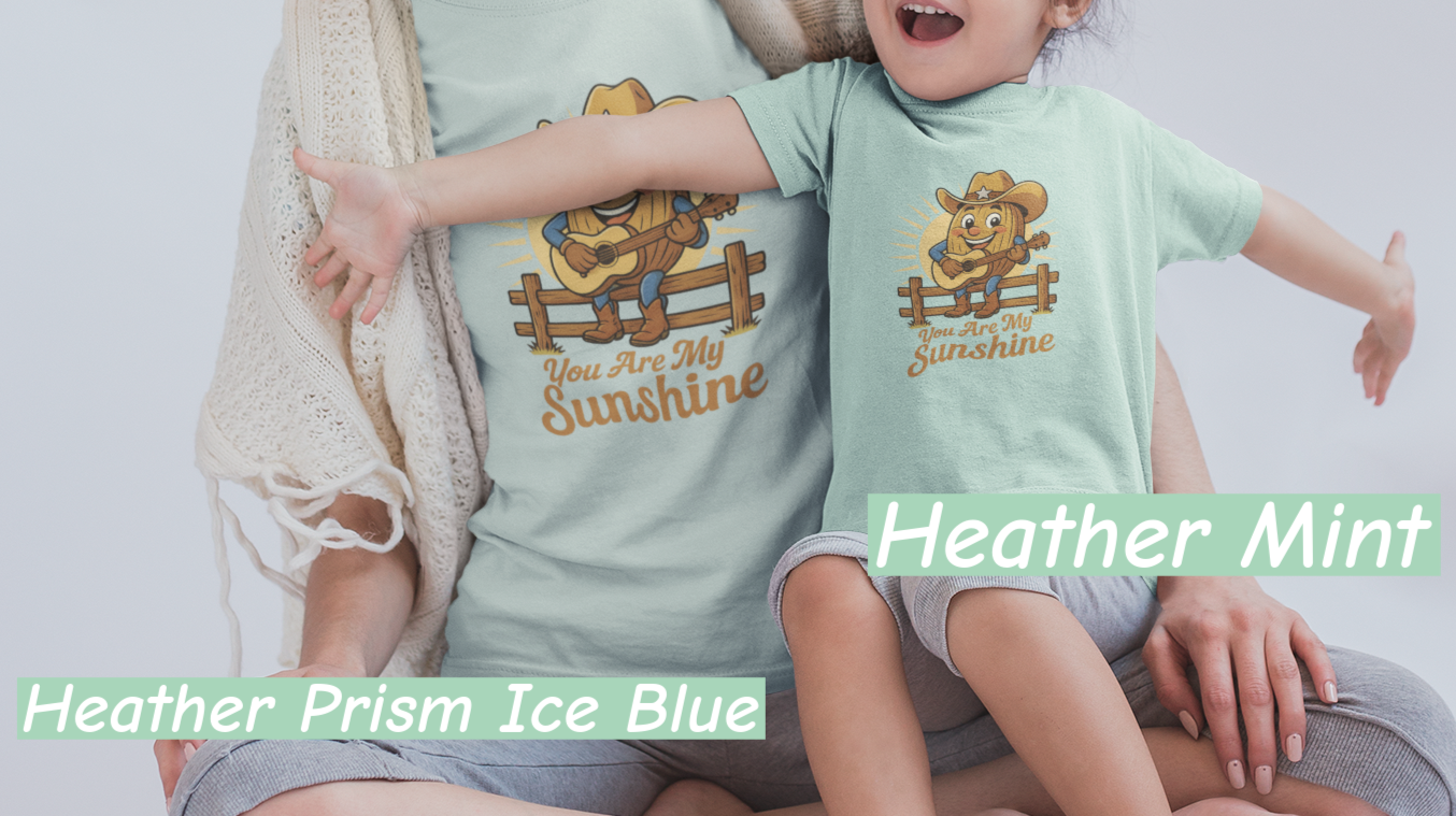Mother and daughter wearing Bella+Canvas 3001 t-shirt with Pecan Pete singing cowboy design and the phrase You Are My Sunshine, vintage western style graphic tee