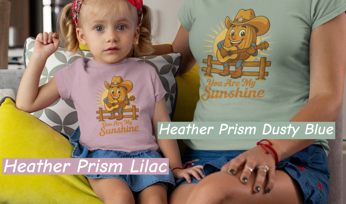 Mother and daughter wearing Bella+Canvas 3001 t-shirt with Pecan Pete singing cowboy design and the phrase You Are My Sunshine, vintage western style graphic tee