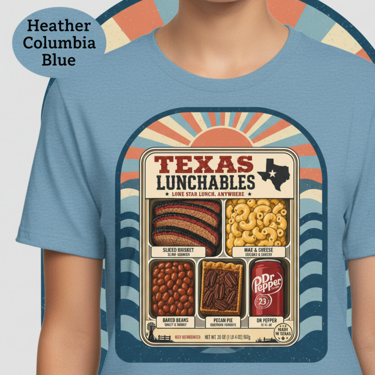 Vintage-style "Texas Lunchables" graphic tee illustrating a classic Texan BBQ meal with brisket, mac and cheese, pecan pie, beans, and a soft drink.
