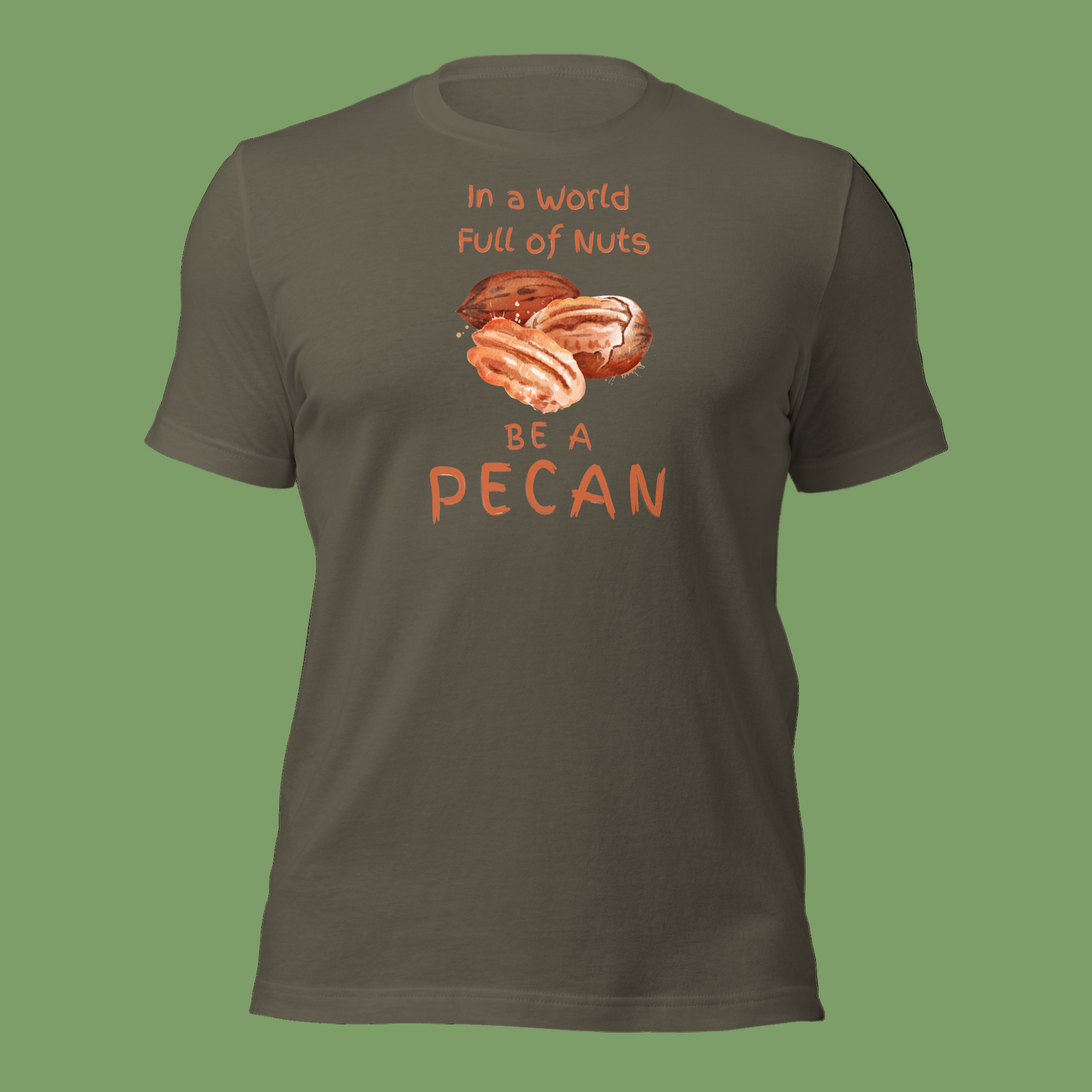 Cartoon-style Pecan Pete on a Bella+Canvas 3001C t-shirt with the slogan “In a world full of nuts, be a pecan.” A playful, humorous design celebrating pecans with a small NuttyMerch logo printed on the back near the neck.