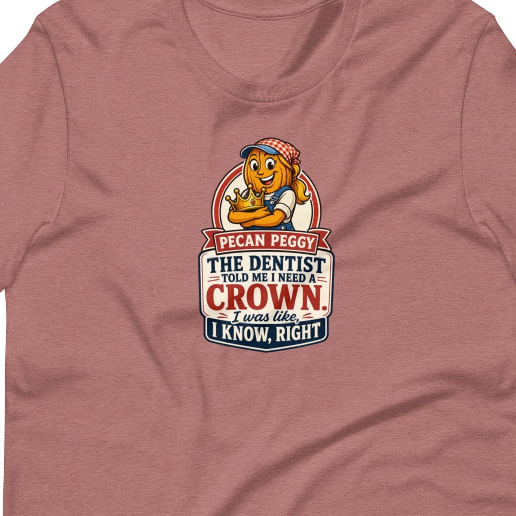 A heathered dusty rose short-sleeve t-shirt with a graphic on the chest featuring a cartoon lion and the text 'I CAN PEGGY THE DENTIST AND MY WHISPER CROWN. I KNOW, RIGHT?'.