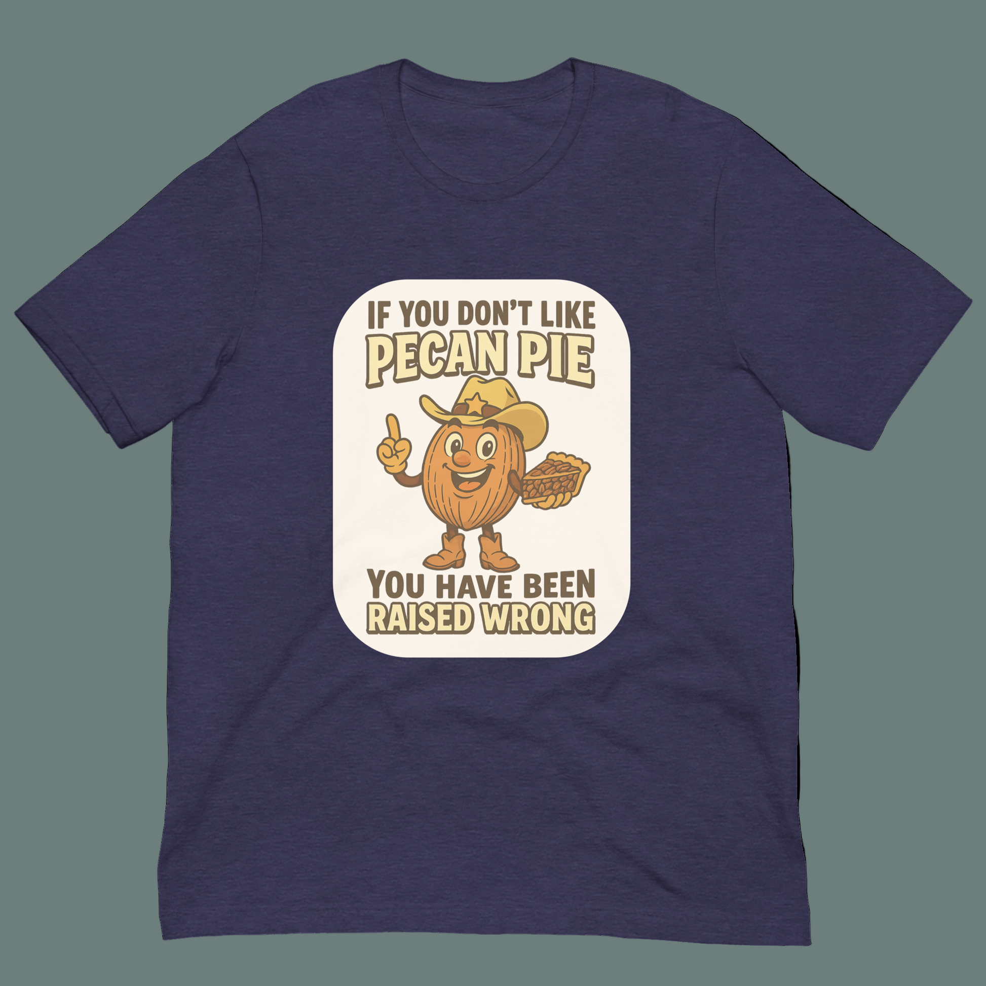 Bella+Canvas 3001U t-shirt made in USA featuring cartoon pecan cowboy holding pie in front of University of NuttyMerch with text ‘If you don’t like pecan pie, you have been raised wrong.’”