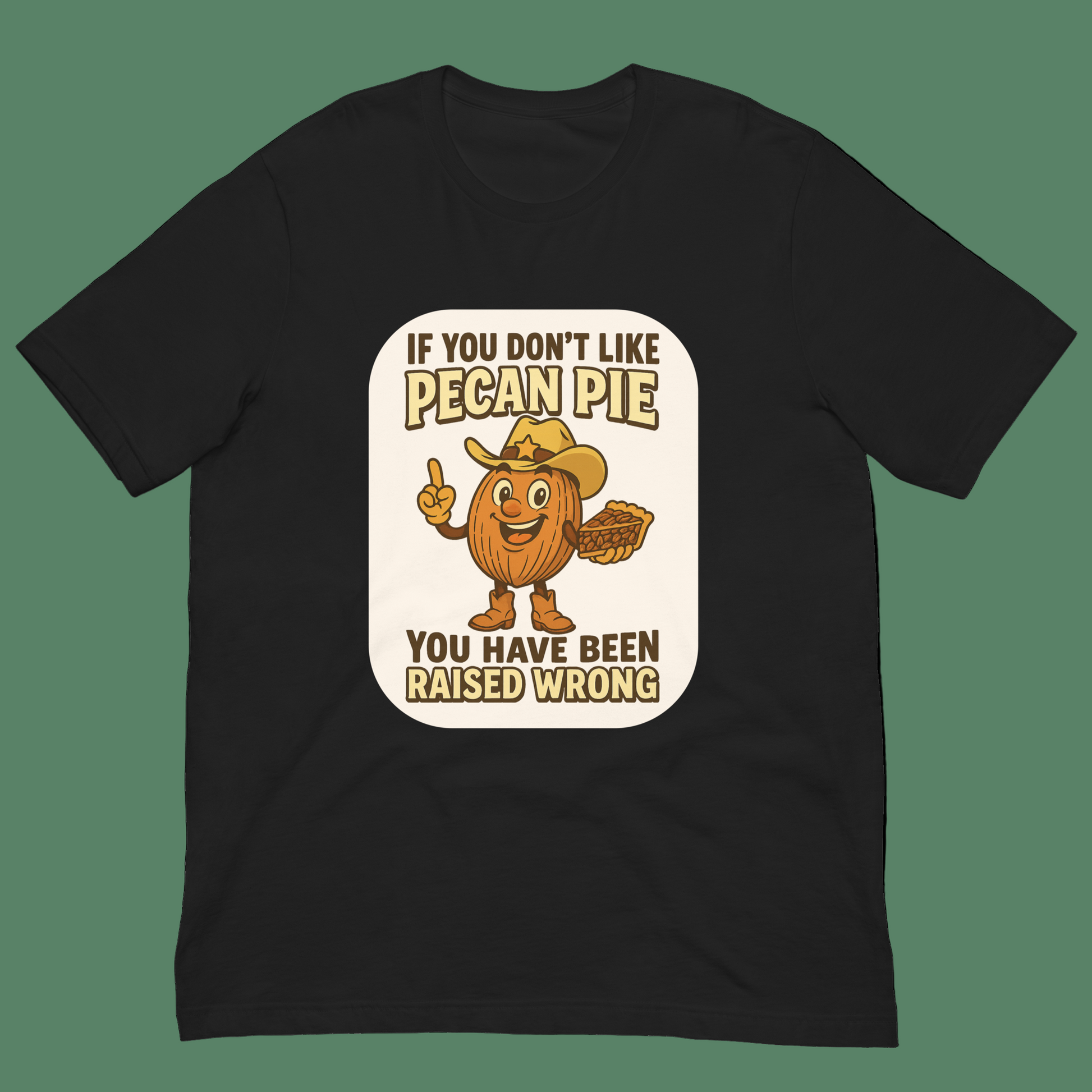 Bella+Canvas 3001U t-shirt made in USA featuring cartoon pecan cowboy holding pie with text ‘If you don’t like pecan pie, you have been raised wrong.’