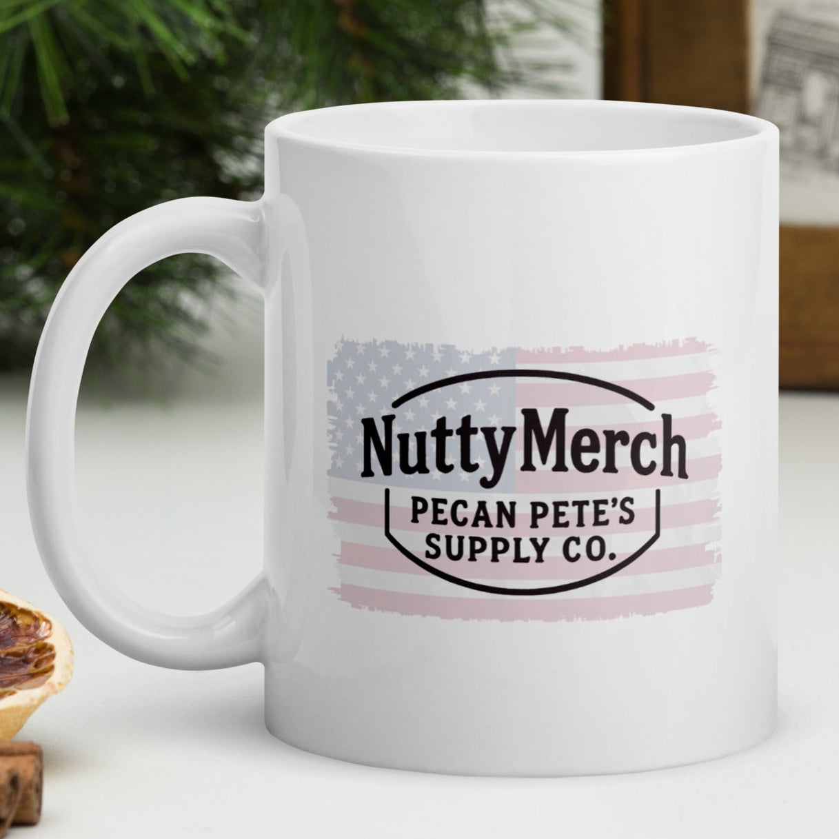White ceramic mug with a distressed Texas flag design and the word “PECANS,” sitting on rustic wooden table with Texas-themed background.